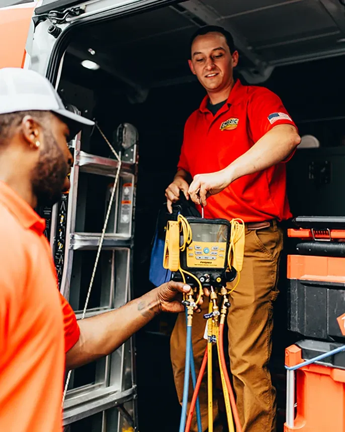 Embrich Plumbing, Heating & Air Conditioning service expert organizing professional plumbing equipment inside service truck in Collinsville