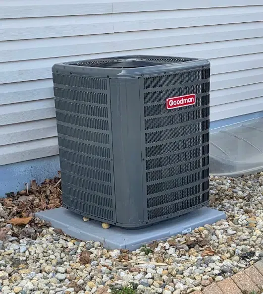 Goodman outdoor air conditioning unit installed beside a Collinsville home.