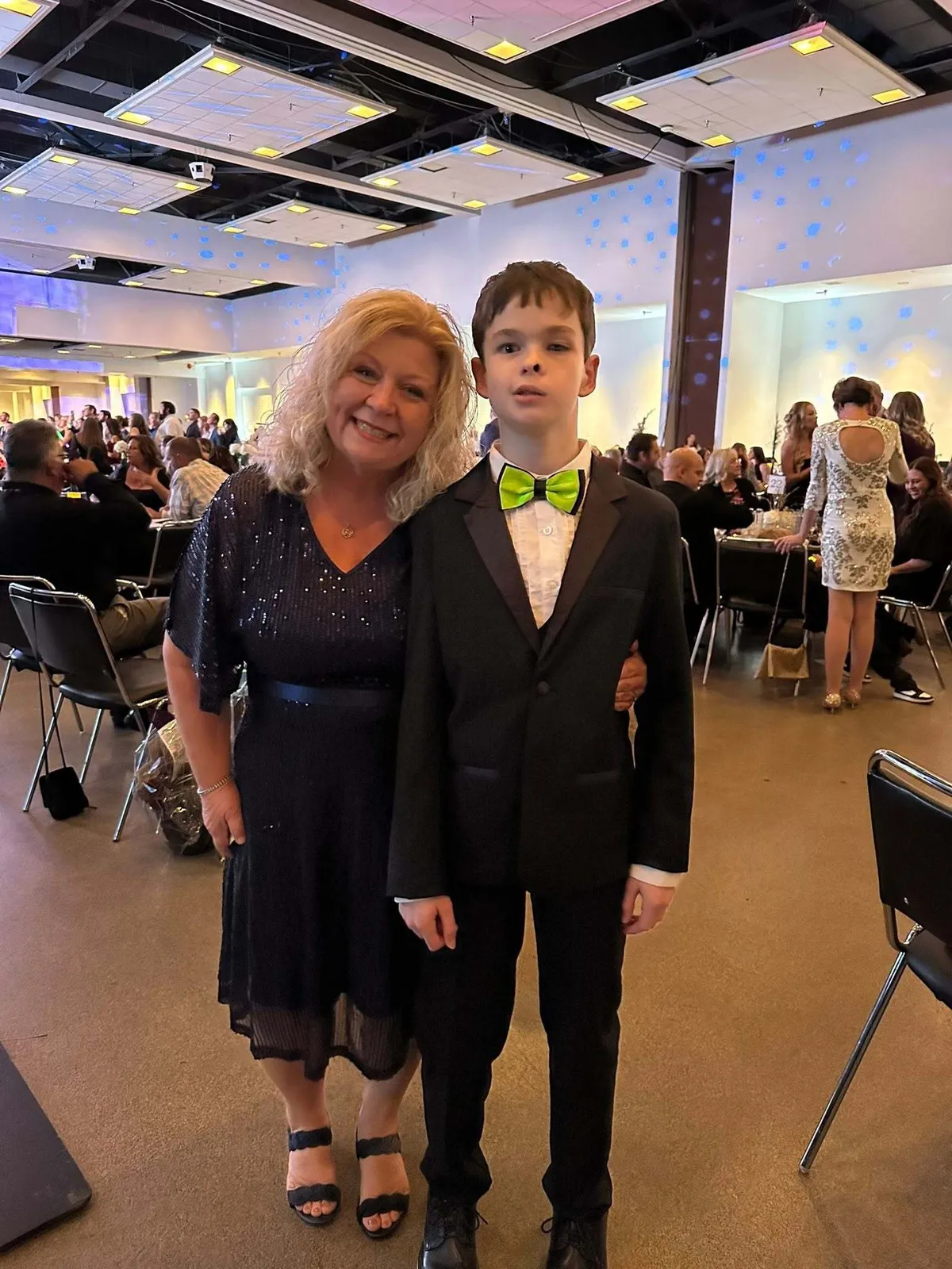 Night of Rockstars honoree posing with a guest in the ballroom