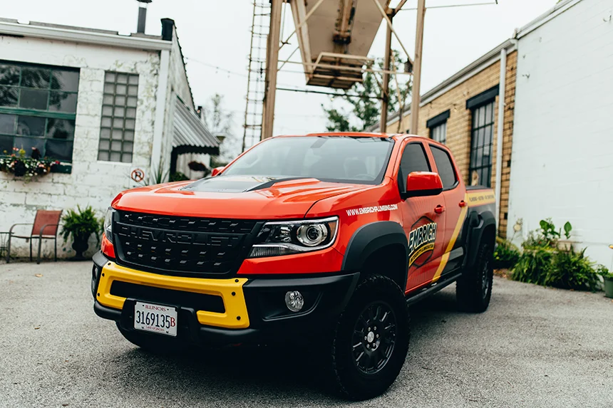 Embrich Plumbing, Heating & Air Conditioning red service vehicle used for residential plumbing service calls in Collinsville